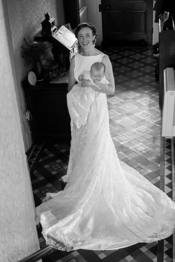 Bride holding a baby