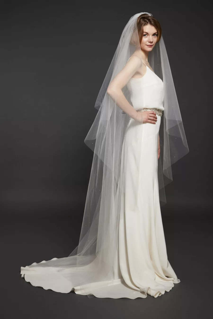 Model wearing a floor length plain veil