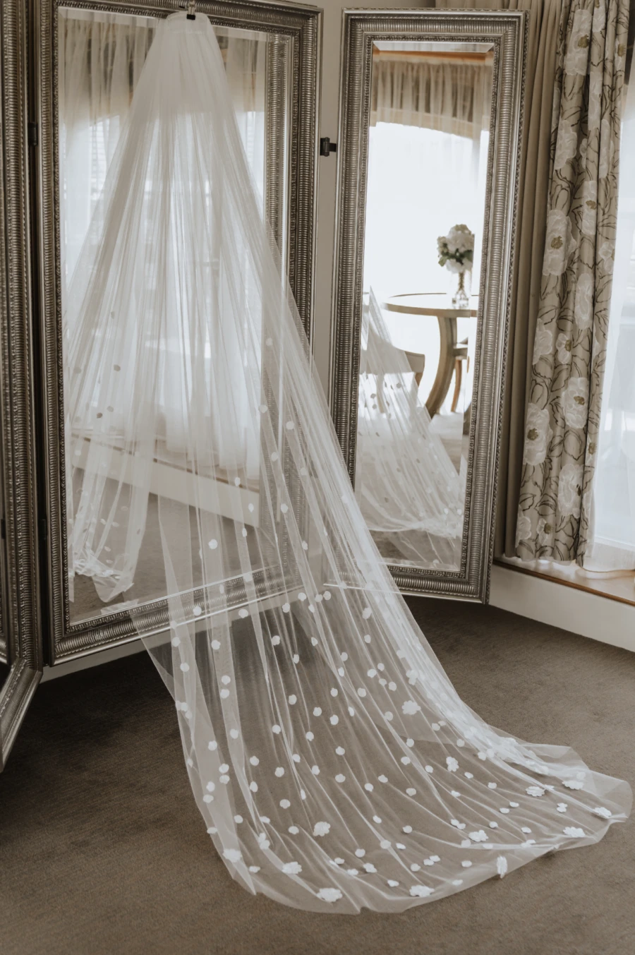 Long veil hanging on mirror