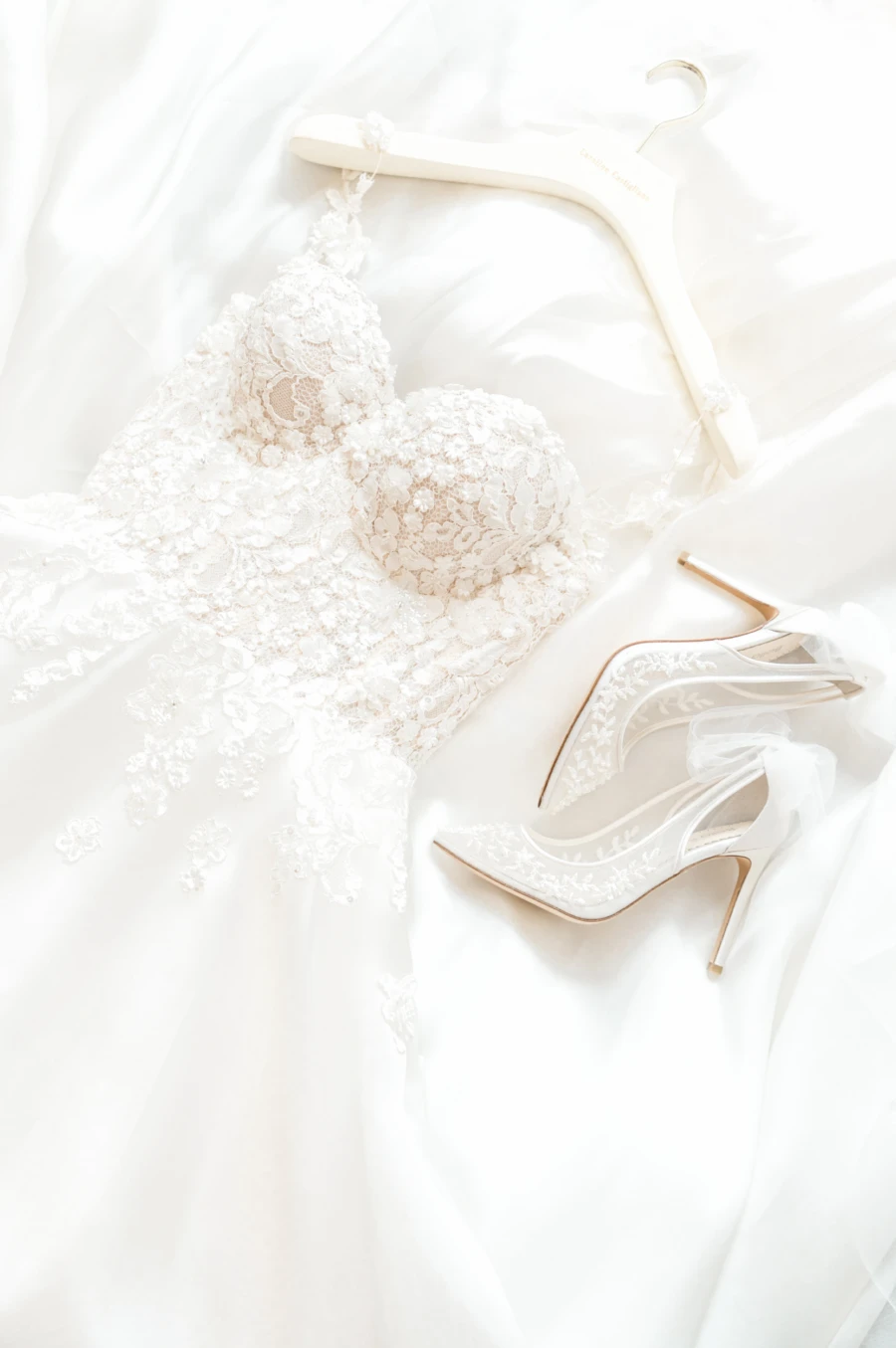 Wedding dress on hanger with shoes